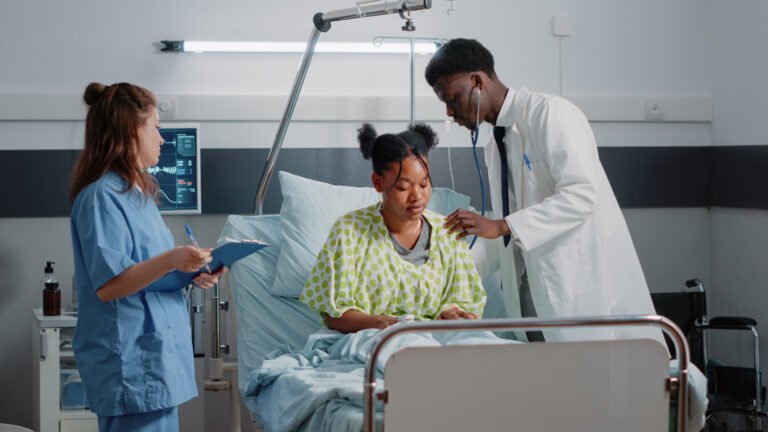 african-american-medic-using-stethoscope-ill-patient-check-heartbeat-examination-cure-sickness-specialist-doing-healthcare-consultation-while-nurse-giving-assistance
